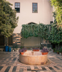 Old fountain of syrian ancient house in ancient City of Damascus (Syrian Arab Republic) in...
