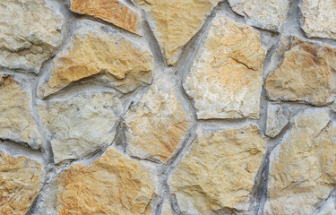 Stone wall texture. Natural cobblestone wall as background.