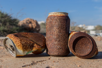rusty tin cans, rusty drink can, rusty can of soda, rusty can lying in the field, rusty can, old...