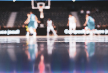 blurred background of basketball players on court during game - very shallow depht of field