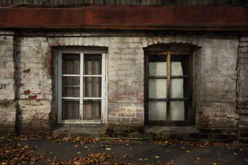 Two windows ground floor of an old stone house. Voronezh, Russia.