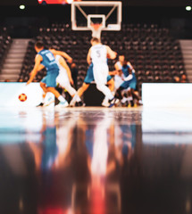 blurred background of basketball players on court during game - very shallow depht of field