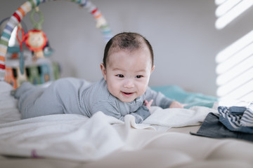 Asian baby boy doing tummy time