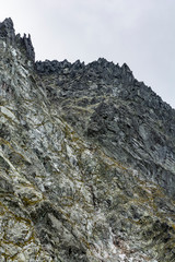 Rock wall slaughterhouse. Various rock formations on the wall on which climbers and mountaineers climb.