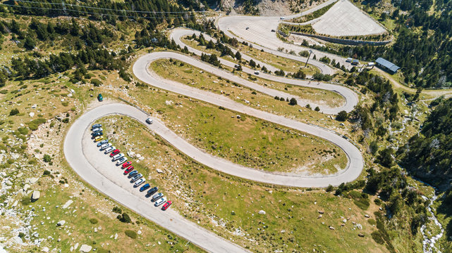 Aerial view of zig-zag road crossing mountain region, Girona, Spain.