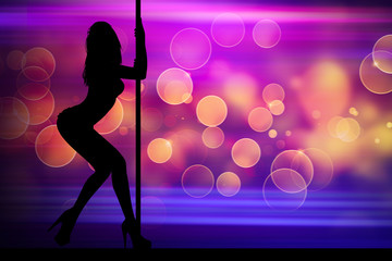 Silhouette of dancing girl in night club with light background