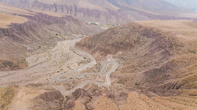 Aerial view of road zig-zagging at Quebrada del Humahuaca, Argentina.