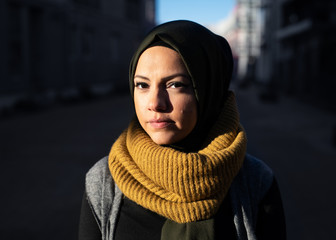 Portrait of a young woman wearing headscarf in the sunshine