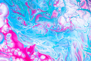 Colorful abstract background with mixed acrylic paints. Hand painted in the style of Fluid art. Decorative marble backdrop
