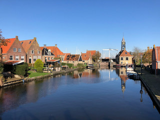 Fototapeta na wymiar Canal in Hindeloopen during autumn