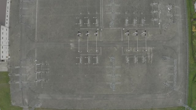 Electric Power Transformator Station in the field in the city Drone 4K shot