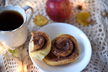 Cozy fall composition with cinnamon rolls and tea, autumn flatlay with copy space