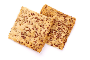 Crispy breads with sesame and flax seeds, crackers, isolated on white background