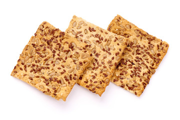 Crispy crackers with sesame and flax seeds, isolated on white background