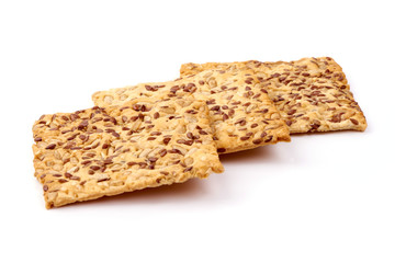 Crispy breads with sesame and flax seeds, crackers, isolated on white background
