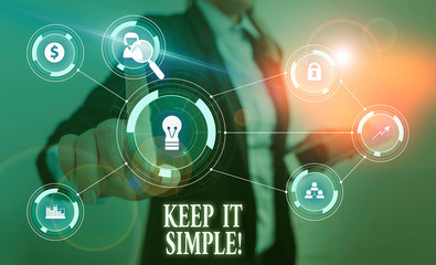 Text sign showing Keep It Simple. Business photo text ask something easy understand not go into too much detail Woman wear formal work suit presenting presentation using smart device