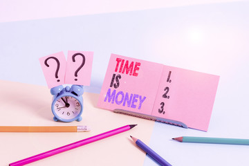 Conceptual hand writing showing Time Is Money. Concept meaning time is a valuable resource Do things as quickly as possible Mini size alarm clock beside stationary on pastel backdrop