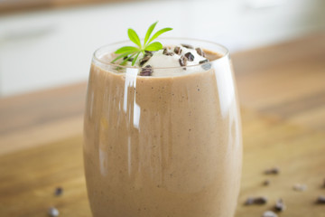 Food photography of a panut butter chocolate banana smoothie