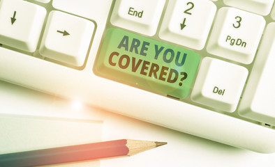Writing note showing Are You Covered Question. Business concept for asking showing if they had...