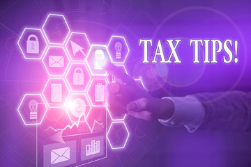 Writing note showing Tax Tips. Business concept for compulsory contribution to state revenue levied by government Picture photo network scheme with modern smart device