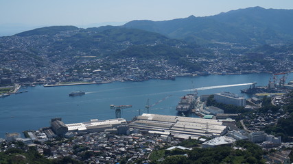 Aerial panoramic view to the seaport in Nagasaki city from the mount Inasa observation platform, Kyushu, Japan.