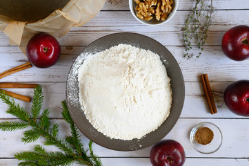 cooking apple pie do it yourself. photo from a series of pictures about cake preparation. tutorial. top view, flat lay. photo 7, in the dough added sifted flour and baking powder