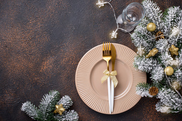 Christmas table setting and golden decor