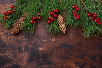 Christmas background with fir tree branches and holly. View from above. Copy space - Image