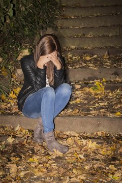 Sorrowfull woman with headaches. She is sad and unhappy. What might be the reason