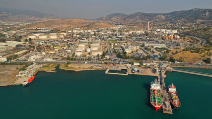 Fototapeta premium Aerial drone photo of industrial refinery of Hellenic Public Petroleum company in gulf of Aspropirgos, Attica, Greece