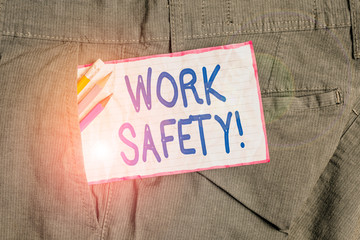 Text sign showing Work Safety. Business photo text policies and procedures in place to ensure health of employees Writing equipment and white note paper inside pocket of man work trousers