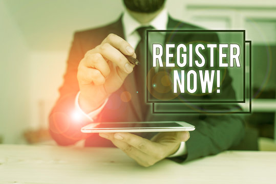Conceptual hand writing showing Register Now. Concept meaning official list or record showing or things into web or forum Male human wear formal clothes present use hitech smartphone - Powered by Adobe