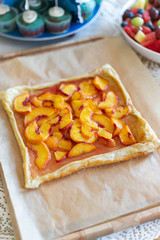 Rustic square peach galette on table