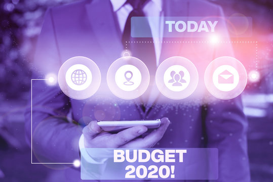 Conceptual hand writing showing Budget 2020. Concept meaning estimate of income and expenditure for next or current year Picture photo network scheme with modern smart device