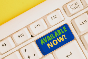 Text sign showing Available Now. Business photo showcasing you can find it obtain or operable at this current moment White pc keyboard with empty note paper above white background key copy space