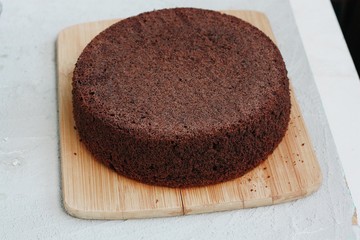 Delicious chocolate cake on a wooden table