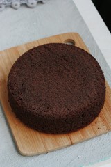 Delicious chocolate cake on a wooden table
