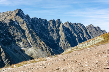 The first autumn frosts and the first patches of snow on the peaks in the ridge of Hruby Ridge (Hrube, Hrubo). Landscape Tatra Mountains, Slovakia.