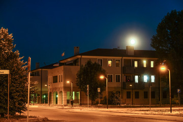 Fototapeta na wymiar Ferrara, Italy - July, 17, 2019: image of a night street in Italy