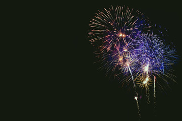 Fototapeta premium Abstract colored firework background with free space for text