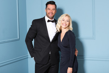 Couple in love posing together wearing evening elegant dress.