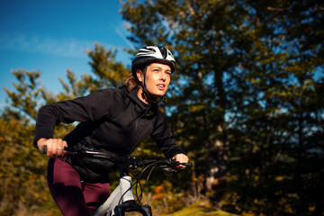 Portrait of female cyclist riding bike outdoor