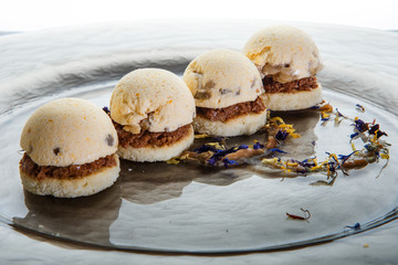 closeup finely decorated spherical sponge biscuits against white