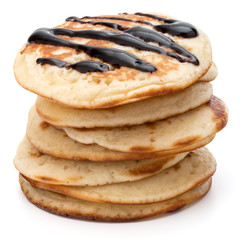 Pancakes  stack with chocolate syrup on white background