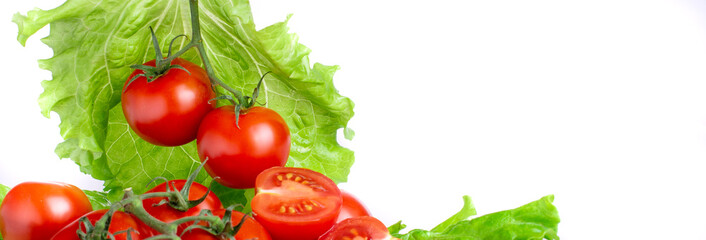 ripe tomatoes with lettuce leaves on a white background