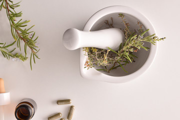 Mortar with medicinal herbs top alternative medicine close up