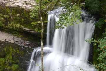 Fototapeta na wymiar Idyllic landscape of a waterfall in Wales, United Kingdom