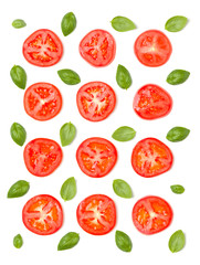 Creative layout made of tomato slices and basil leaves. Flat lay, top view. Vegetables isolated on white background. Food ingredient pattern.