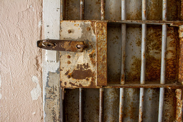 rusty jail or prison door with rusted bars