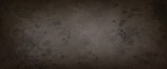 Old vintage brown background in dark coffee colors with black border and distressed grunge texture and paint stains